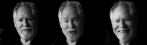 A black and white portrait of a smiling older man with a beard, featured in three similar expressions.